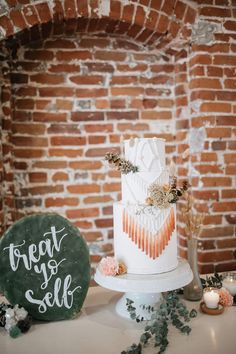 a wedding cake sitting on top of a table