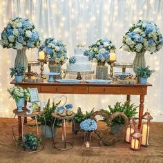 a table topped with lots of blue and white flowers