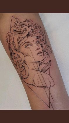 a woman's arm with a tattoo design on it