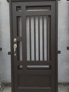 a black door with bars and knobs on it