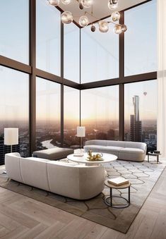 a modern living room with large windows overlooking the city