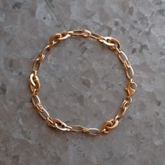 Simple and pretty. This chain bracelet features a mixed link design for a layered look. It has a weighty presence and glides over the skin wonderfully. Finished with a secure lobster clasp that flows into the chain. 100% recycled metal. The Details: Solid recycled 14k gold. Semi solid design. 7.5" in length. Widest link is 0.25". Can be sized smaller upon request. Please send us your wrist measurement. Comes in a a stylish gift box with care instructions and a polishing cloth. Ready to ship! (Wh Link Design, Jewelry Workshop, Cuff Rings, Tourmaline Ring, Recycled Metal, Fine Earrings, Stone Carving, Layered Look, Unique Rings