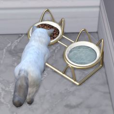 a cat eating food out of a bowl on top of a stove with two plates