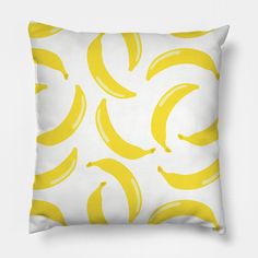 a yellow banana pattern on a white pillow