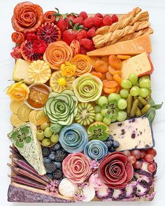 an assortment of fruits and vegetables arranged in the shape of a square