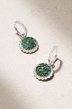 "When I wear any of my emerald jewelry, it instantly elevates my confidence and gives a boost to my serotonin levels," Valeria Johnson tells <i>PORTER</i>. Set with Gemfields Zambian emeralds, House of Meraki's 'Rania' earrings have been made in Italy from 18-karat white gold and finished with sparkling pavé diamonds. Luxury Round Emerald Diamond Earrings, Luxury Green Sterling Silver Diamond Earrings, Luxury Green Diamond Earrings In Sterling Silver, Green Sterling Silver Luxury Diamond Earrings, Fine Jewelry Emerald Earrings, Round Shape, Emerald Halo Earrings In Fine Jewelry Style, White Gold Emerald Diamond Earrings, Emerald Halo Design Earrings Fine Jewelry, Emerald Halo Earrings Fine Jewelry