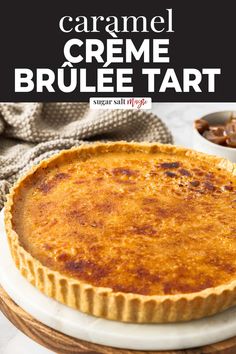 a close up of a pie on a plate with the words caramel creme brule tart