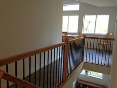 an empty room with stairs leading up to the second floor