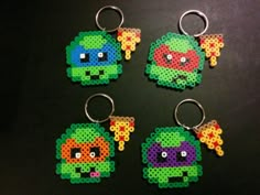 four perler keychains made to look like teenage mutant ninja turtles