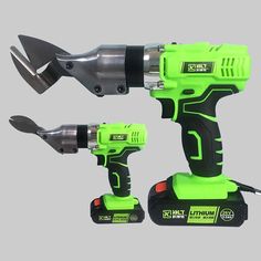 two cordless drillers with tools attached to them on a gray background, one is green and the other is black