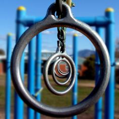 a close up of a metal ring on a playground