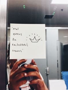 a person holding up a piece of paper with the words real queens for each other's crowns written on it