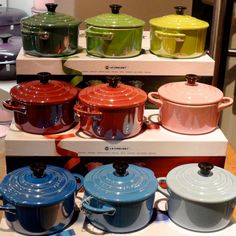 several pots and pans on display in a store