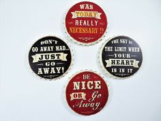 four bottle caps with different sayings on them