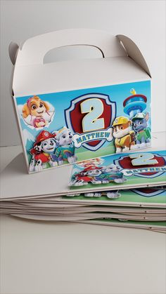 an unopened paw patrol birthday party box with the number two on it and other items