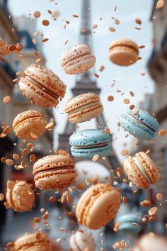 macaroons falling down from the sky in front of the eiffel tower