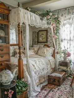 a bedroom with a canopy bed and floral wallpaper on the walls, along with antique furniture