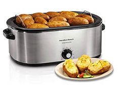 two plates with food in front of an electric crock pot and one plate with bread on it