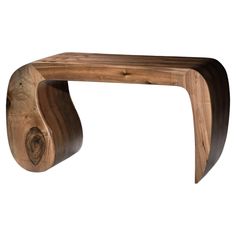 a wooden bench made out of wood with curved legs and an oval shaped design on the top