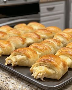 several croissants sitting on a baking sheet