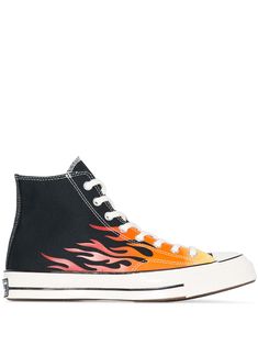 If there is a shoe that belongs in every wardrobe every season, it's Converse. An indisputable footwear legend, a pair of these mainstays will take you a long way. These black and orange canvas Chuck 70 flame-print sneakers from Converse feature a flat white rubber sole, a lace-up front fastening and a round toe. Black Chuck 70, Black Chucks, Vans Vault, Air Jordan 9, Balenciaga Track, Converse Black, Black Converse, Converse Chuck 70, Flat White