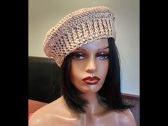 a mannequin head wearing a crochet hat on it's head