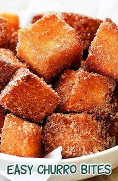 a white bowl filled with sugary cubed food next to the words easy churro bites