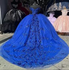 Make your quinceanera an unforgettable celebration of beauty and elegance with this stunning off-the-shoulder royal blue dress. The dress is crafted from delicate tulle, creating a timeless, princess-inspired look, while the chapel-train adds a dramatic, regal touch. The off-the-shoulder neckline exudes classic sophistication, and the sleeveless design enhances the graceful flow of the gown. The intricate applique detailing on the bodice and skirt elevates the dress, creating a harmonious blend Royal Blue Quince Theme, Royal Blue Quince Dress, Navy Blue Quinceanera Dresses, Quince Blue, Blue Quince Dress, 15 Birthday Dresses, Baby Blue Quinceanera, Royal Blue Ball Gown, Royal Blue Quinceanera Dresses