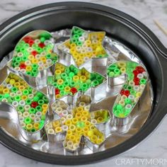 a pan filled with lots of different colored beads