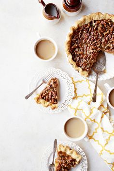 pecan pie with two cups of coffee on the side