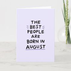 the best people are born in august card on a marble table with two vases