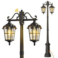 an old fashioned street lamp with two lights on each pole and one light attached to it