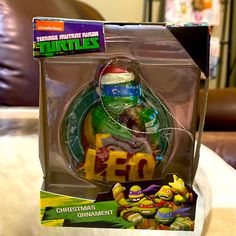 the teenage mutant ninja turtles christmas ornament is in its box