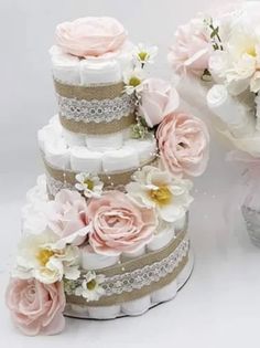 two stacks of wedding cakes with pink and white flowers