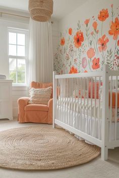 a baby's room with an orange and white floral wallpaper on the walls