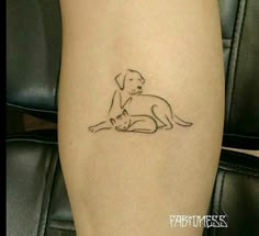 a small dog and cat tattoo on the right side of the calf's leg