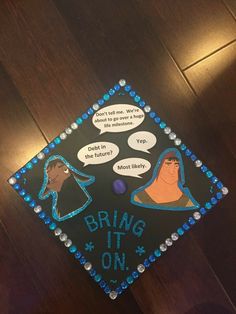 a graduation cap that says bring it on