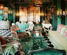 an ornately decorated living room with green walls and flooring is seen in this image