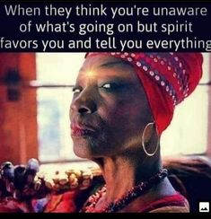 a woman wearing a red turban with an interesting quote on the side that says, when they think you're unattene unaware of what's going on but spirit flavors you and tell everything