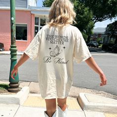 Get ready to fall in LOVE with your new Your Words Matter, Be Kind comfort colors shirt. This shirt features a back print and small butterfly on the front. It's the cutest and most comfortable way to show off the latest styles. Also makes a great gift! * PRODUCT DETAILS * ✺ 100% Cotton ✺ Medium weight fabric (super soft feel) ✺ Wash and dry normally (on cool for best results) ✺ Designed and printed in the USA ✺ Due to different monitor screens, colors may vary ✺ * SIZING * ✺ FOR AN OVERSIZED FIT Casual Cotton T-shirt With Quote Print, White Summer T-shirt With Quote Print, Summer Cotton T-shirt With Quote Print, Casual T-shirt With Back Print For Fall, White Cotton Top With Quote Print, White Cotton Tops With Quote Print, Spring Tops With Back Print And Short Sleeves, White Short Sleeve Top With Quote Print, Cotton T-shirt With Back Print For Fall