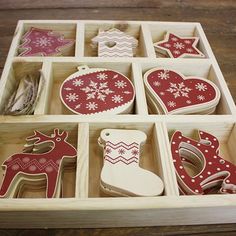 a wooden box filled with assorted christmas decorations