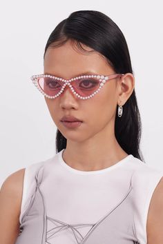 Embrace the perfect fusion of elegance and playfulness with our OPTICALS Pearl-Embellished Cat-Eye Sunglasses. These stunning sunglasses feature inverted triangle-shaped lenses in a classic cat-eye frame, exuding both sophistication and charm. The edges of the frame are adorned with delicate pearls, adding a touch of luxury and refinement. Both the lenses and the frame, including the temples, are semi-transparent, enhancing the chic and modern design. Crafted from premium materials, these sungla Chic Cat Eye Sunglasses With Uv Protection For Party, Summer Evening Cat Eye Sunglasses, Polarized Cat Eye Sunglasses For Party, Polarized Cat Eye Sunglasses For Parties, Cat Eye Sunglasses For Summer Evenings, Summer Evening Cat Eye Sunglasses With Mirrored Lenses, Glamorous Cat Eye Sunglasses With Tinted Lenses, Summer Party Polarized Cat Eye Sunglasses, Party Cat Eye Sunglasses With Gradient Lenses