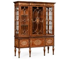 an old fashioned wooden china cabinet with glass doors