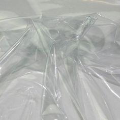 clear plastic bags are laying on top of each other