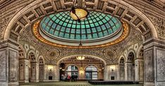 the inside of an ornate building with many windows