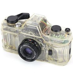 an image of a camera that is in the shape of a plastic case on a white background