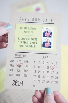 someone is holding up a save our date card