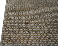 a close up view of a rug with small rocks on the bottom and one side