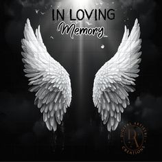 two white wings with the words in loving memory