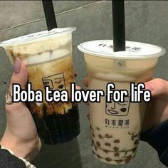 two people holding up drinks with the words boba tea lover for life